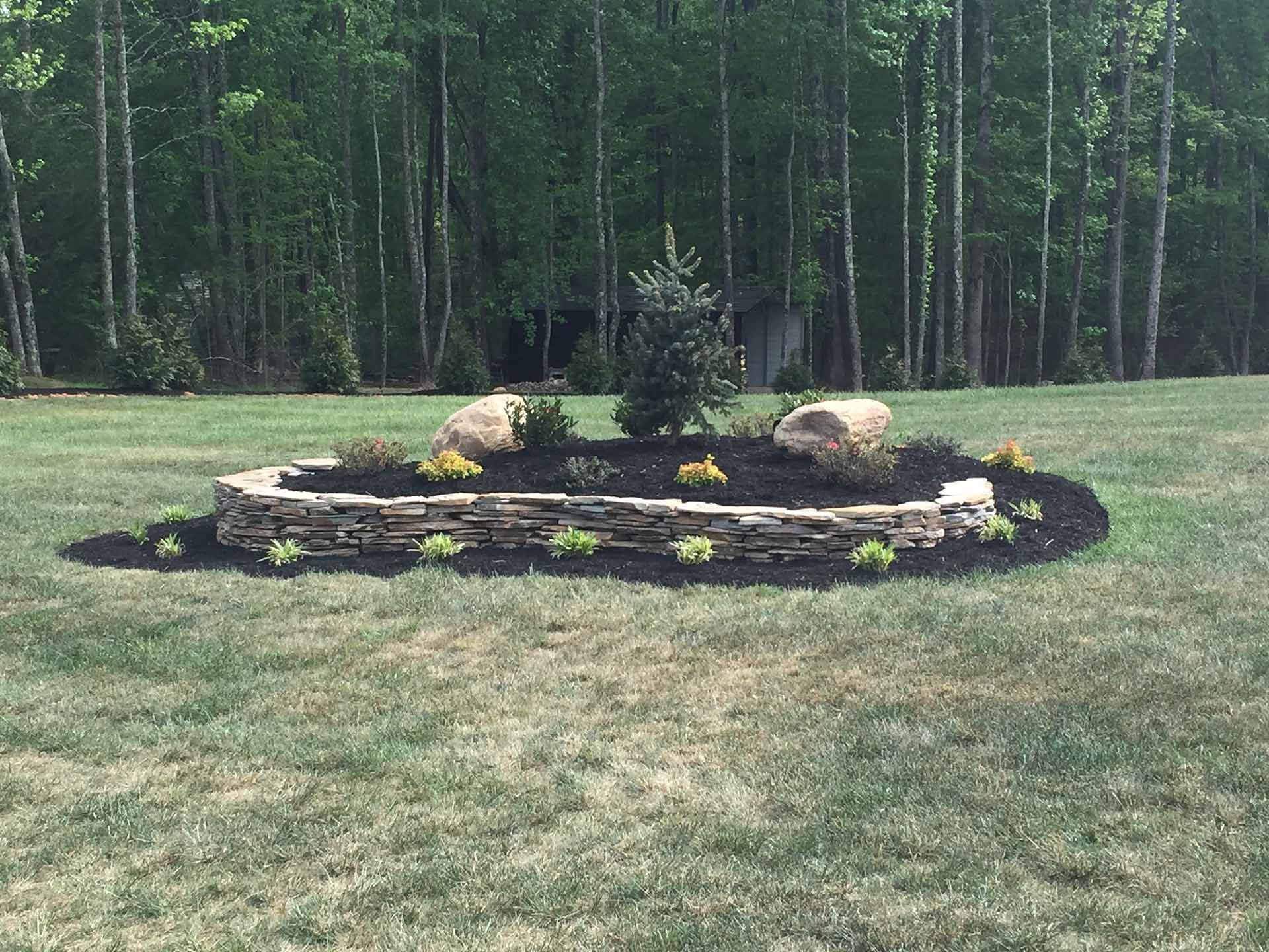 A nice landscape design in the middle of a lush green field