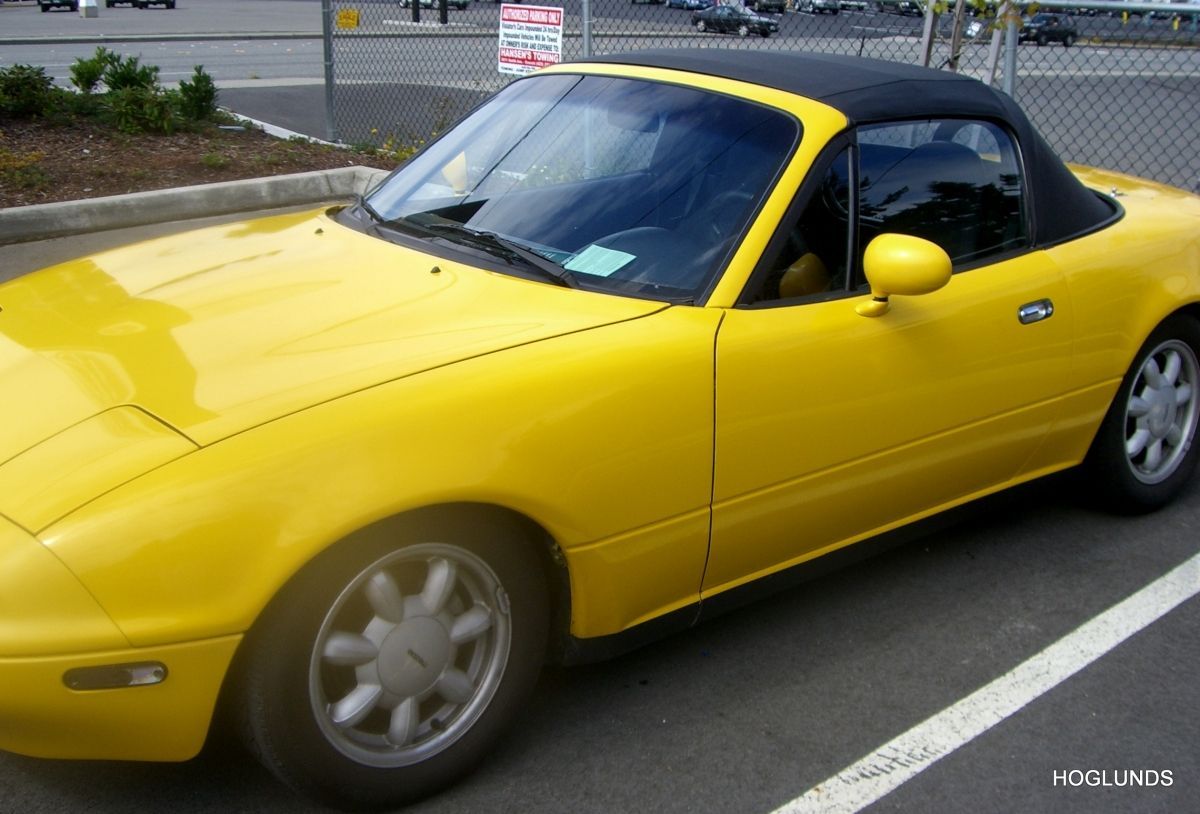 yellow miata roadster convertible