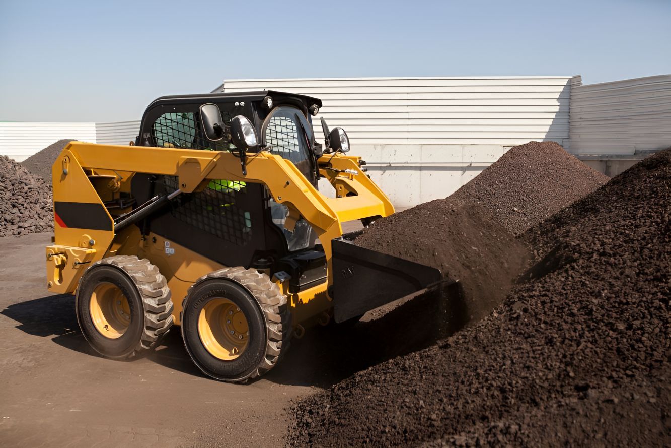 A Bulldozer Is Scooping Dirt from A Pile of Dirt — Norcoast Diggers in Ballina, NSW