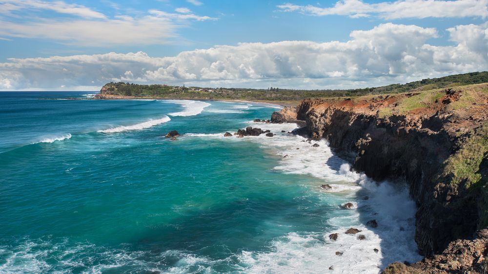 A Cliff Overlooking the Ocean With Waves Crashing on the Shore — Norcoast Diggers in Lennox Heads, NSW