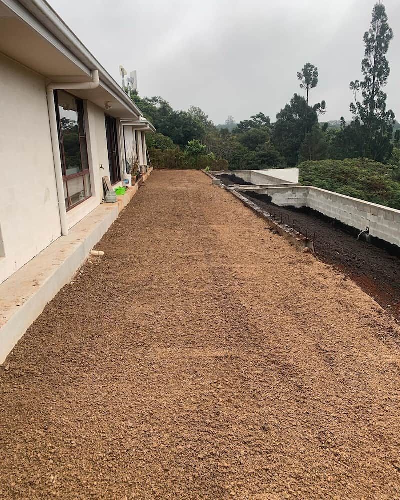 A Dirt Path Leading to a House With Trees in the Background — Norcoast Diggers in Ballina, NSW
