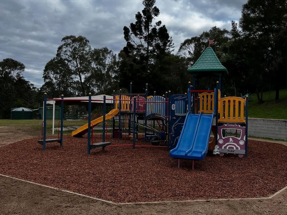 A Colourful Playground in a Park With Trees in the Background — Norcoast Diggers in Ballina, NSW