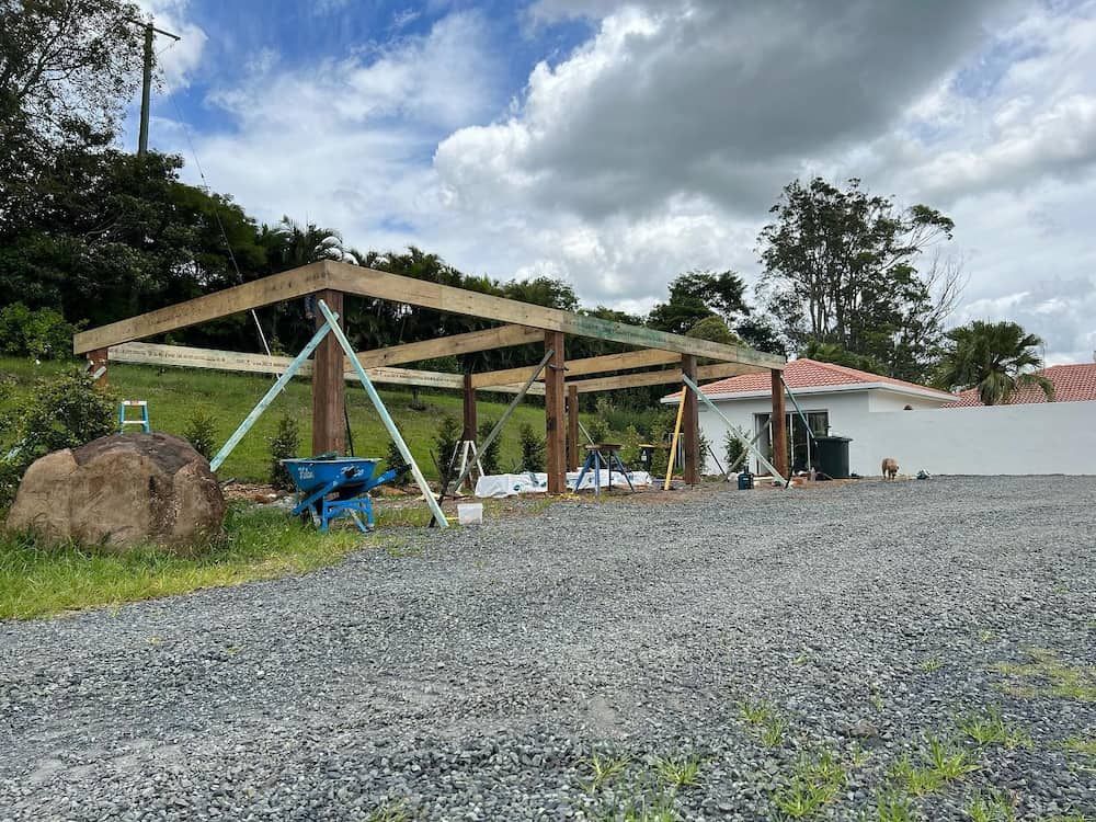 A Wooden Structure is Being Built in a Gravel Lot in Front of a House — Norcoast Diggers in Ballina, NSW