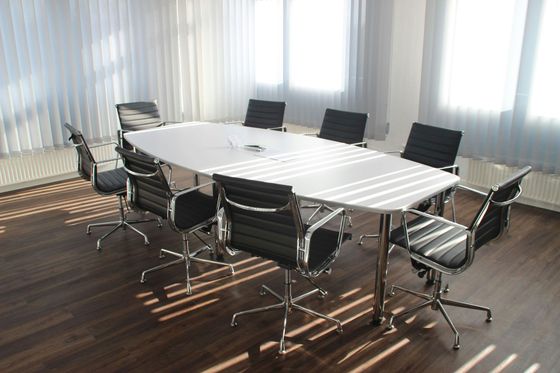 a table with empty chairs around it