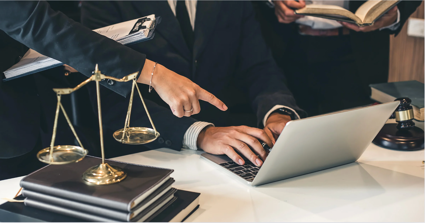 Lawyers searching on a laptop