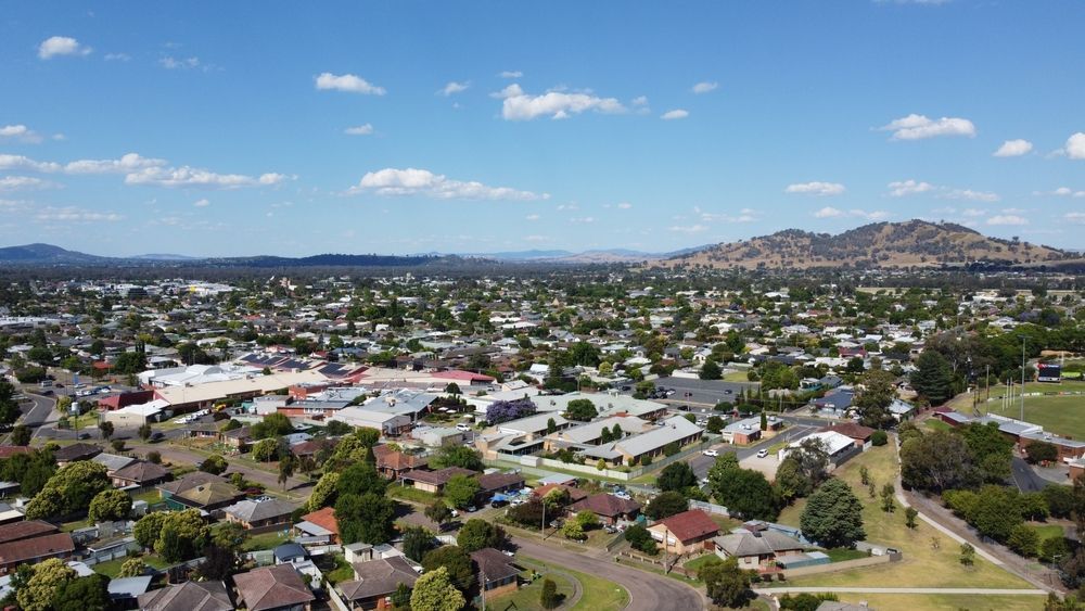 An Aerial View Of A Residential Area With A Mountain In The Background — Law Air Conditioning In Charters Towers, QLD