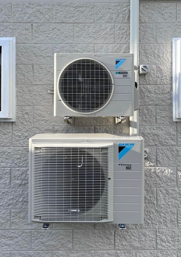 Daikin Air Conditioning Units Mounted On The Side Of A Building — Law Air Conditioning In Annandale, QLD