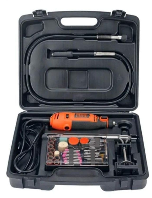Juego de herramientas rotativas de color naranja y negro en un estuche negro con varios accesorios.