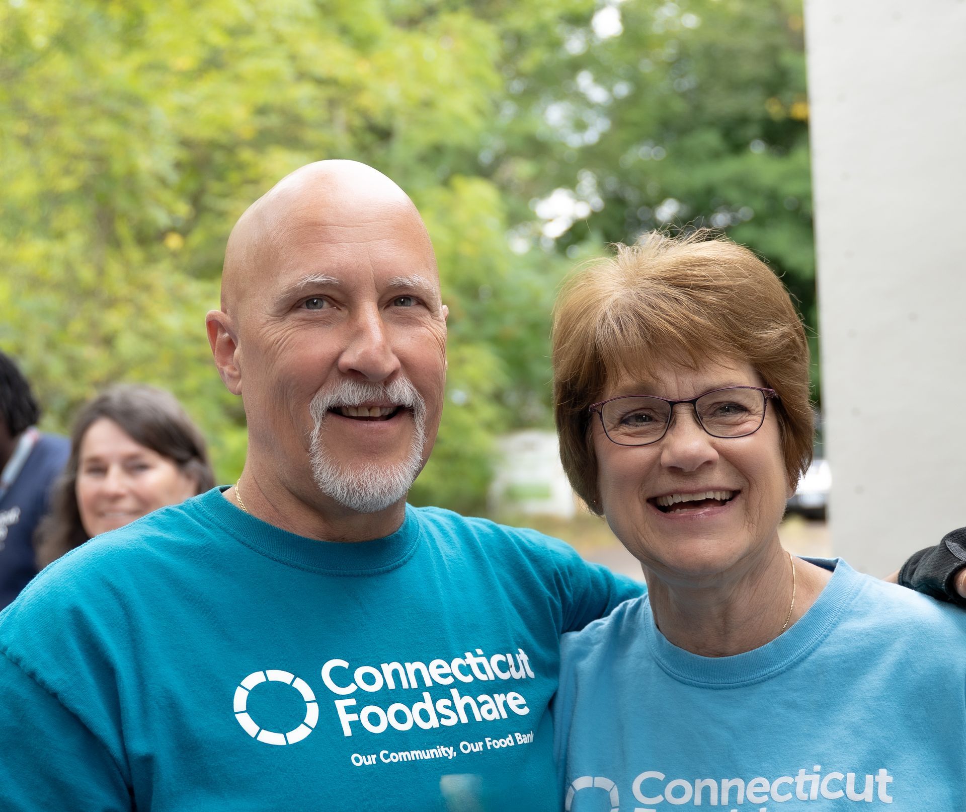 Chris and Jim Wrobel volunteer at a Connecticut Foodshare mobile food pantry.