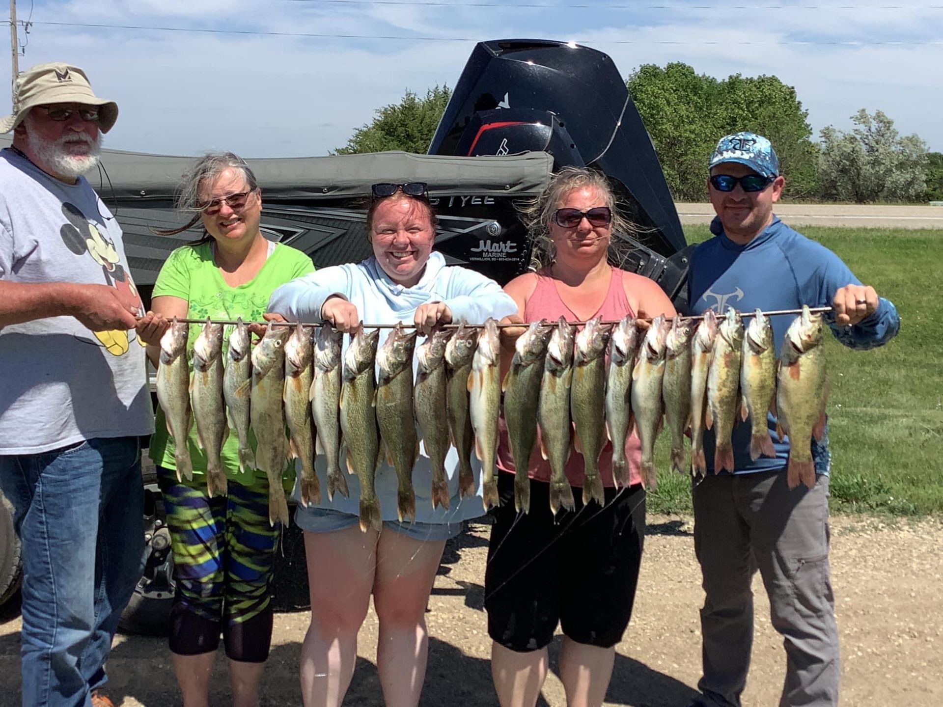 South Dakota Walleye Fishing, family holding the day's catch