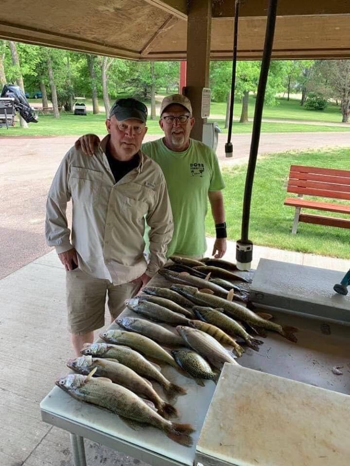 Two men with days catch of walleye, Lake Thompson SD