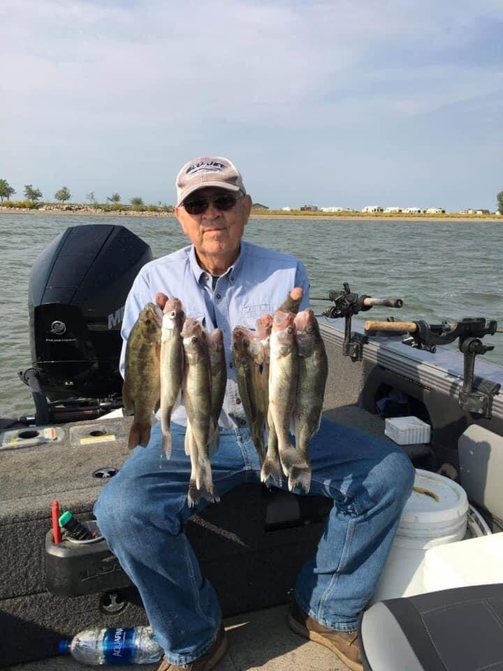 Man holding fish on Lake Thompson, South Dakota