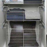 A closet filled with lots of clothes and towels.