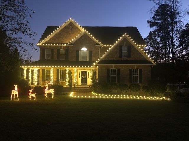 A house with Christmas lights on the front of it