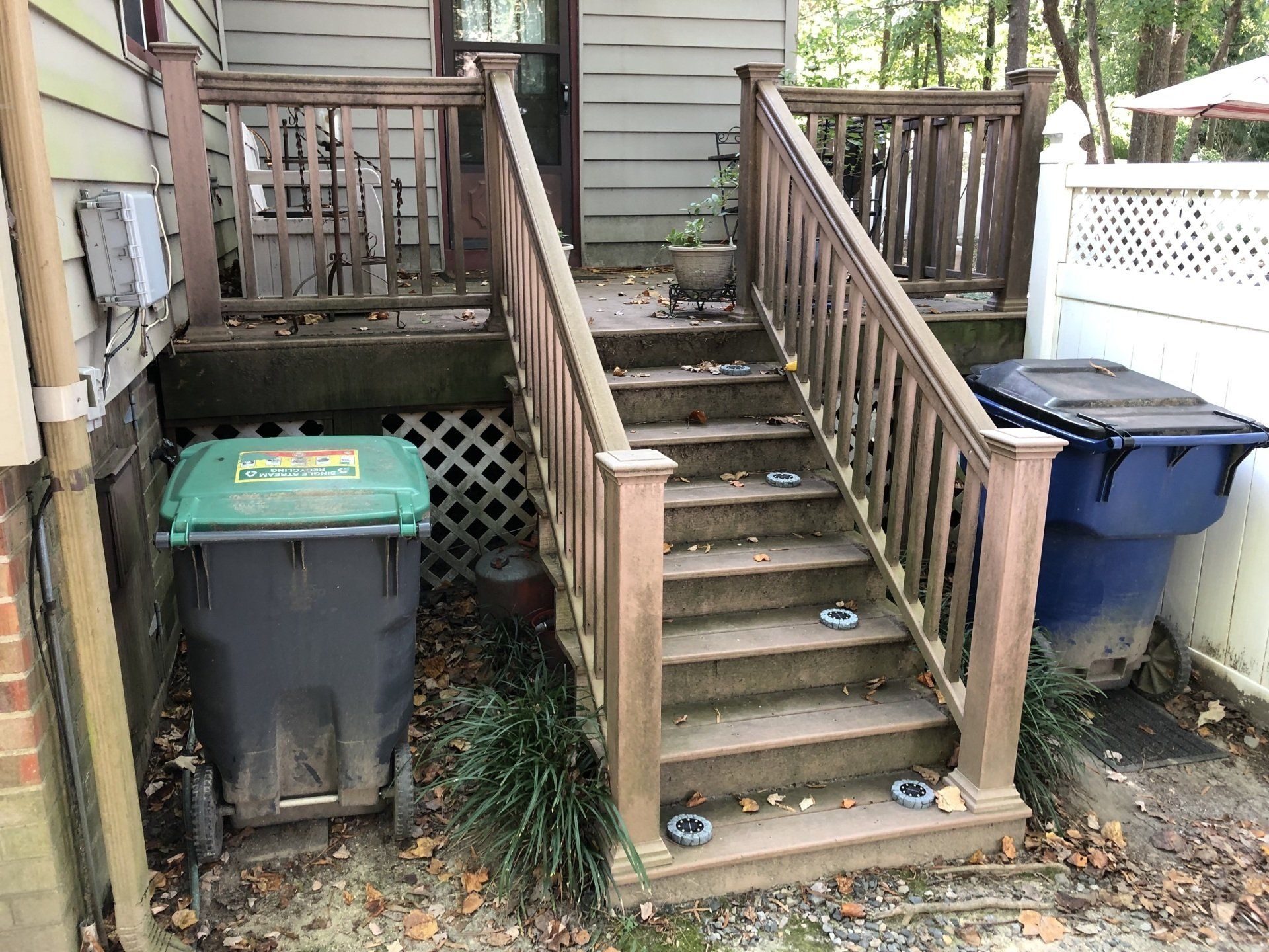 dirty old small balcony, stairs and trashes