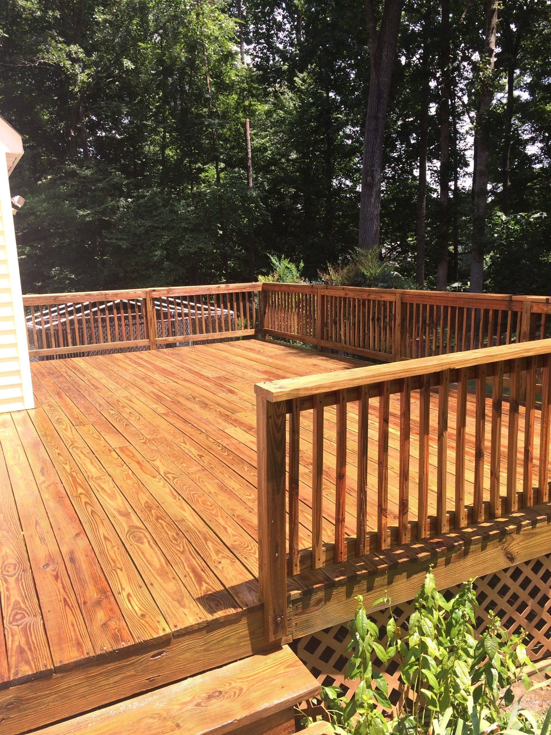 cleaned new look old deck with flowers on the stairs