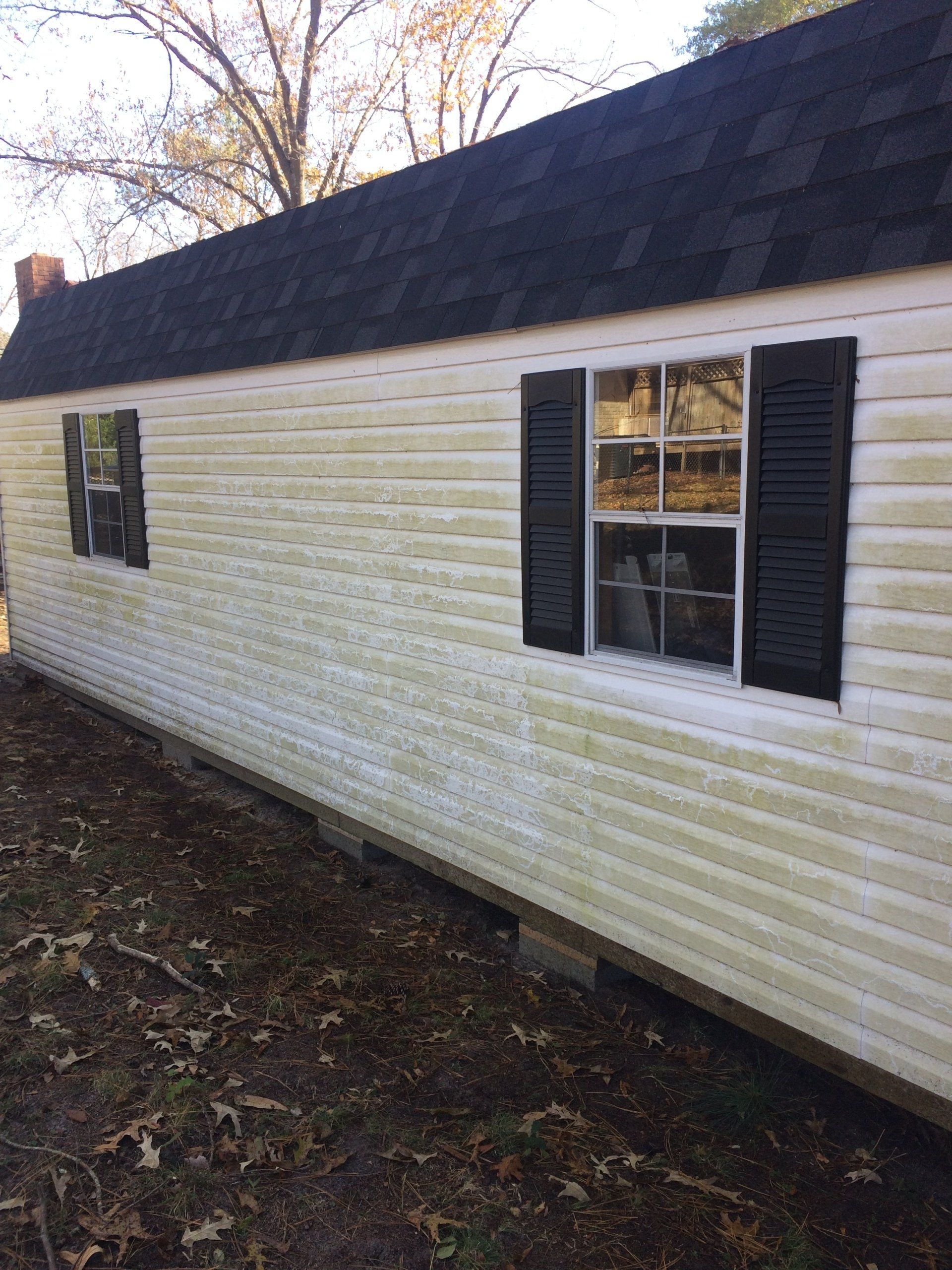 dirty white and black exterior small house