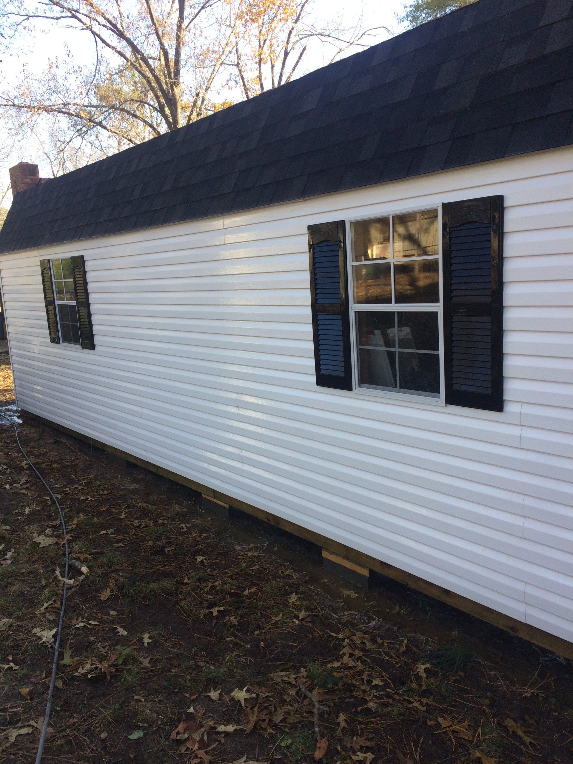 cleaned white and black exterior small house