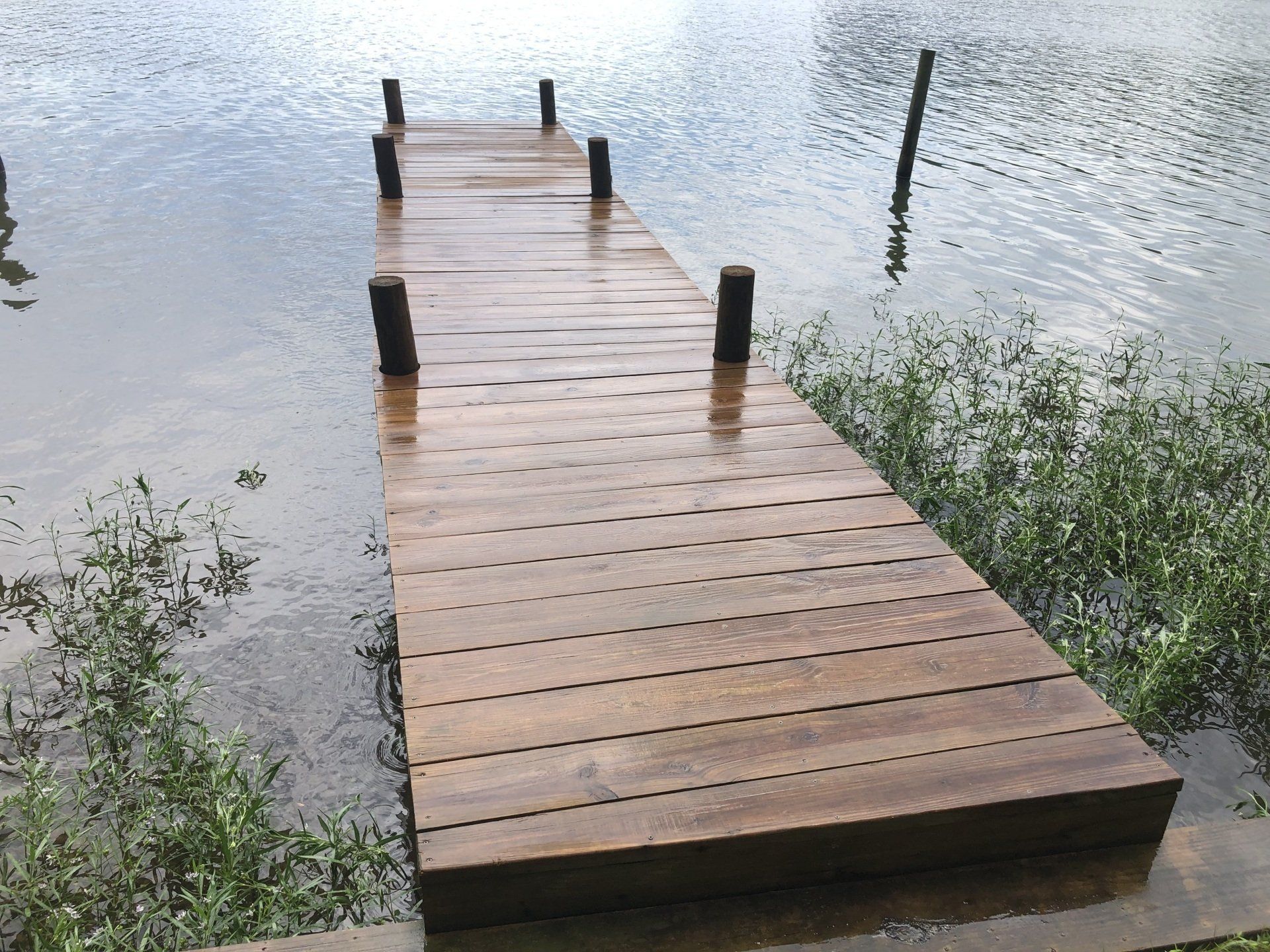 cleaned new look old wooden lake bridge