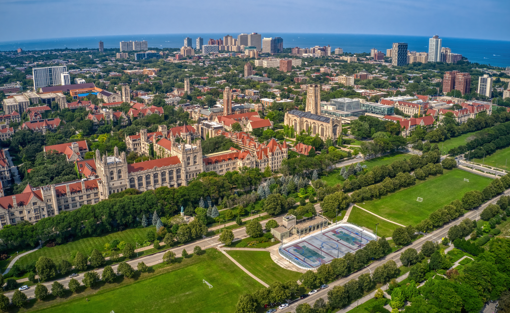 An aerial view of a city with lots of buildings and trees.