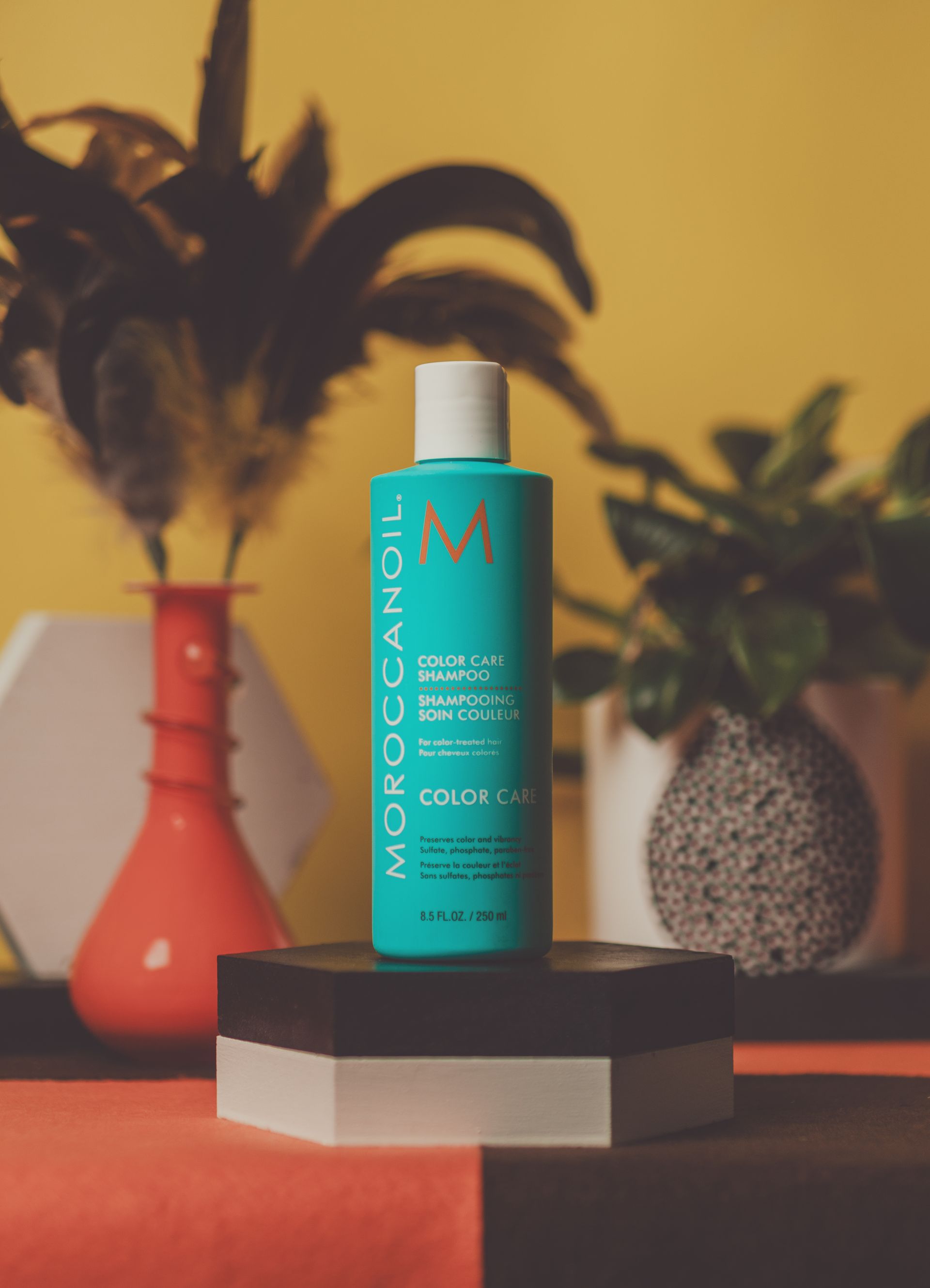 A bottle of moroccanoil is sitting on a table
