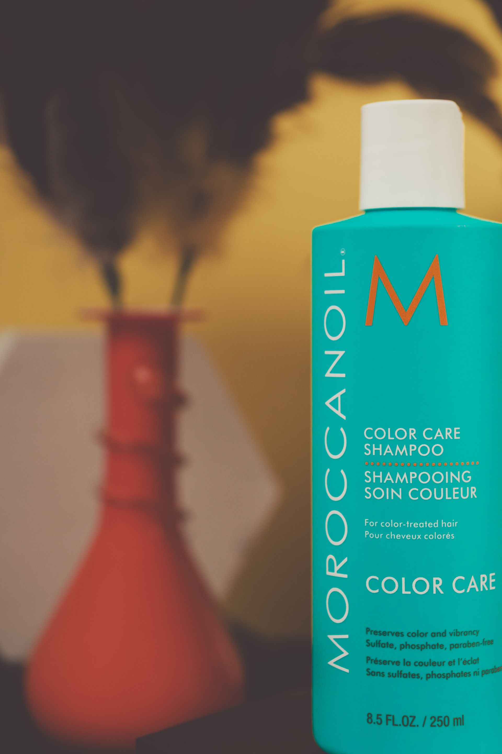 A blue bottle of moroccanoil color care shampoo