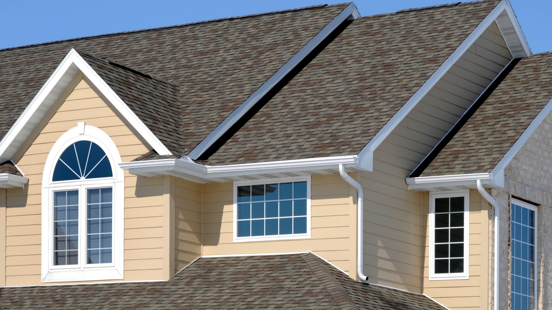 A white van with the word services on the side is parked in a gravel lot.