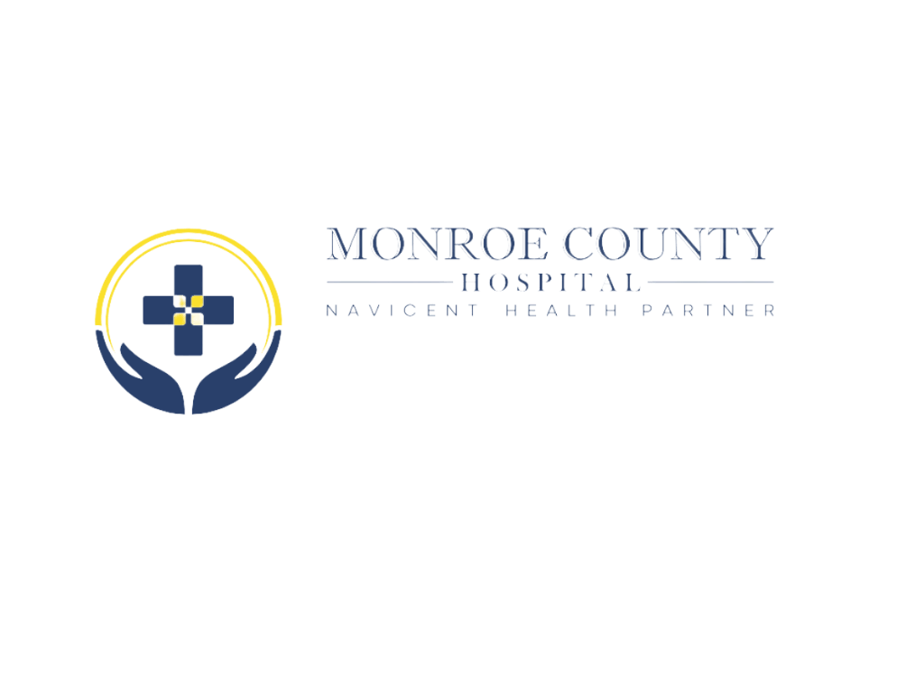 The logo for monroe county hospital shows a cross in a circle with hands holding it.