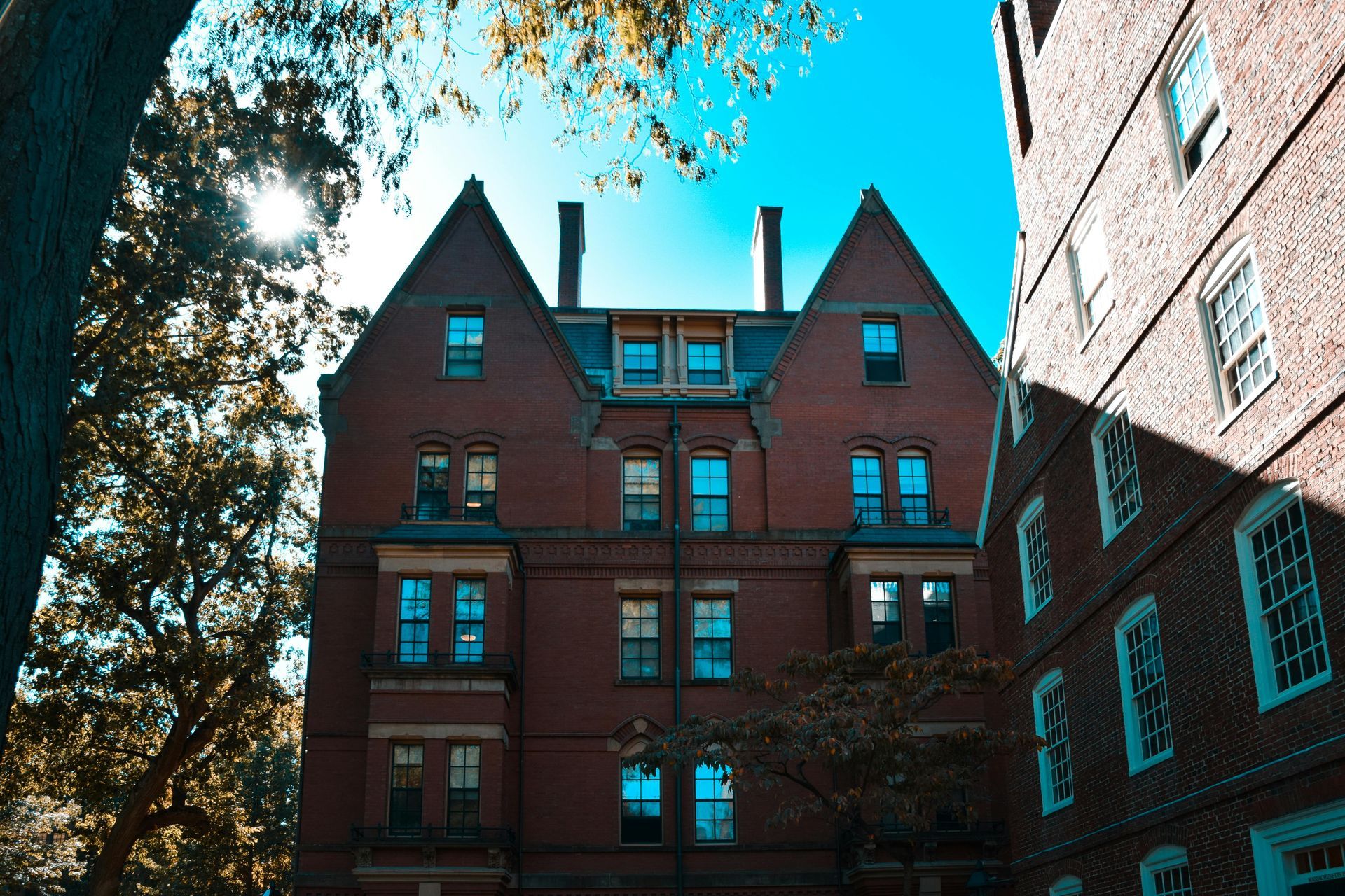 A large brick building with a blue sky in the background
