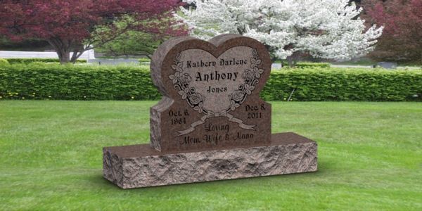 A black gravestone in a cemetery with the name allen on it.
