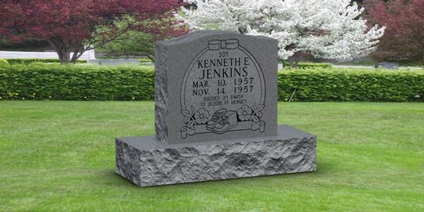 A gravestone for kenneth jenkins is sitting on top of a lush green lawn.