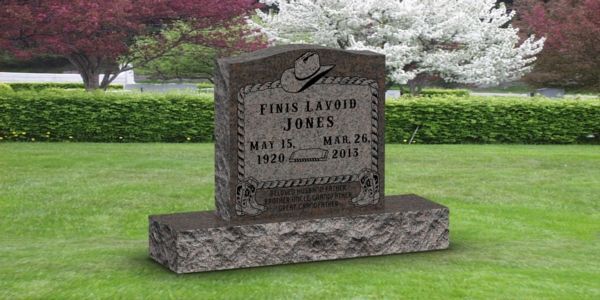 A gravestone in a cemetery with a cowboy hat on it.