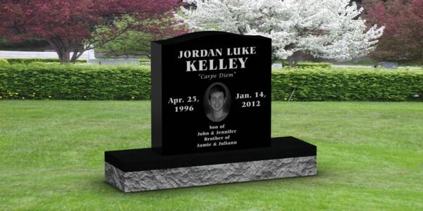 A black gravestone with the name kelly on it