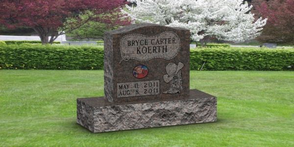 A gravestone in a cemetery with flowers in the background.