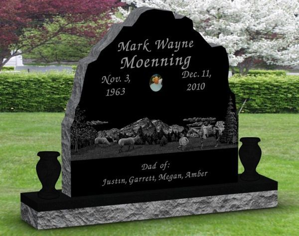A black gravestone with the name mark wayne moenning on it