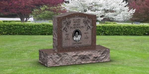 A gravestone in a cemetery with a picture of a woman on it.