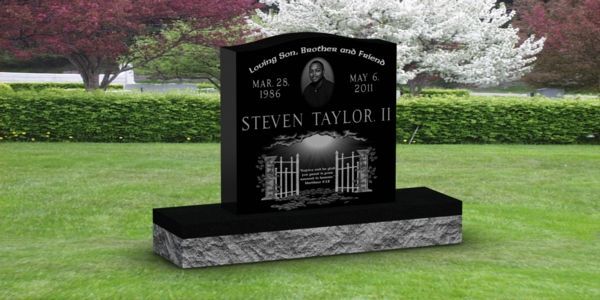 A black gravestone with the name steven taylor ii on it