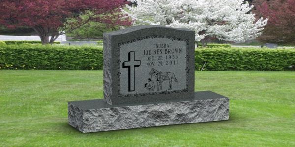 A gravestone with a cross on it in a cemetery.