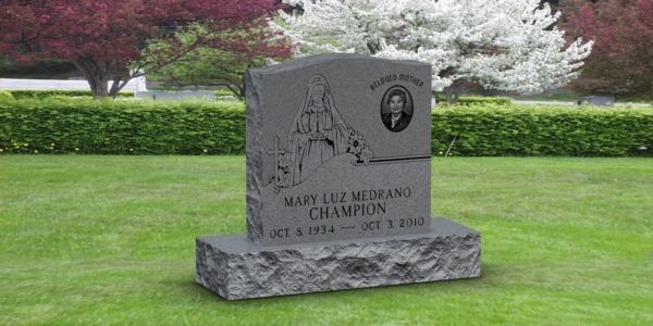 A gravestone in a cemetery with flowers in the background.