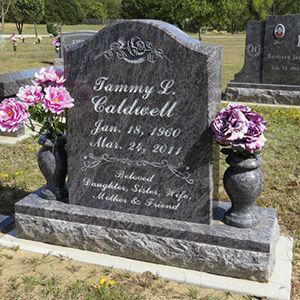 A living room with a couch , chairs and lamps