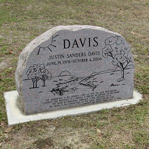 An empty church with wooden floors and a brick wall