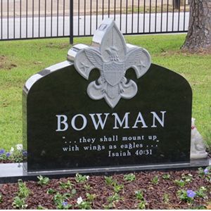 A room with a table and chairs and a ceiling fan