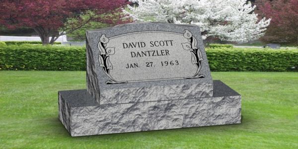 A black gravestone with the name alexander on it