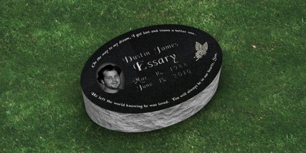 A red gravestone with the name bellamy on it