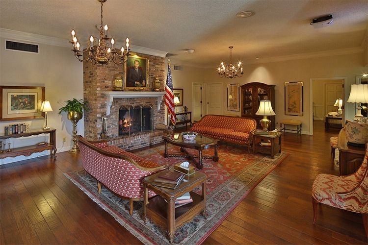 A living room filled with furniture and a fireplace.