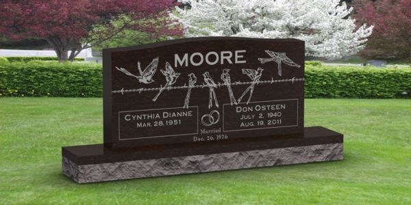A gravestone in a cemetery with the name moore on it