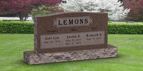 A gravestone in a cemetery with the name lemons on it.