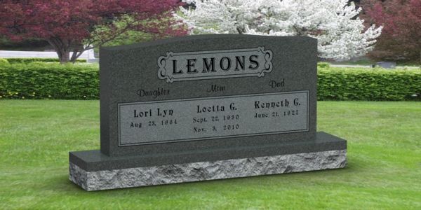 A gravestone in a cemetery with the name lemons on it