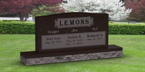 A gravestone in a cemetery with the name lemons on it
