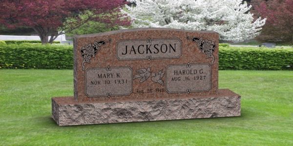 A gravestone in a cemetery with the name jackson on it.